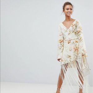 ASOS DESIGN wrap dress in floral print with fringe
